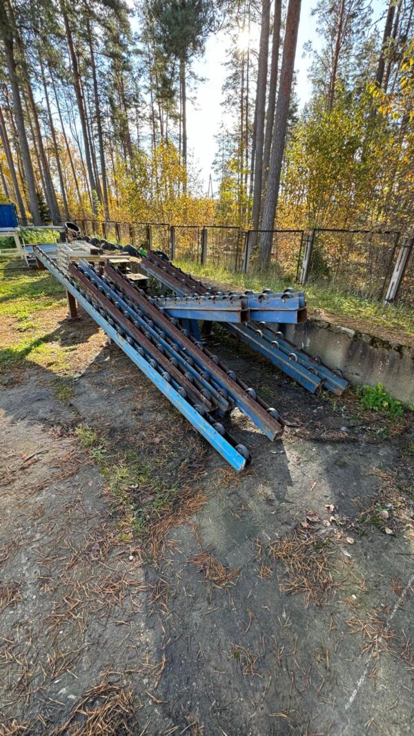 Dēļu iepakošanas transportieris